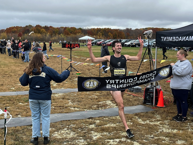 Junior Kevin Arseneauz crossing the finish line during the PAC Championship